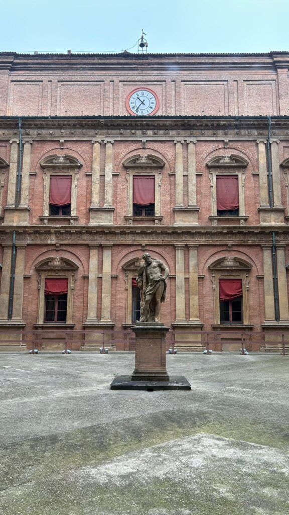 implementation of weekly consolidated cash flow report - building courtyard with clock